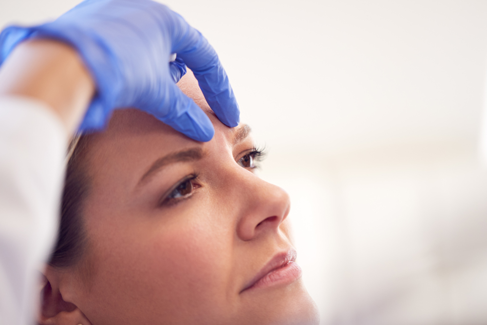 Beautician Or Doctor Preparing Female Patient For Anti Ageing procedure